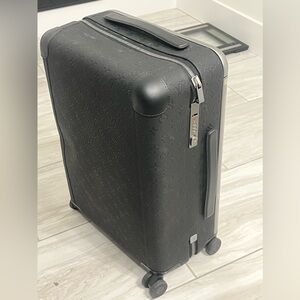 Louis Vuitton leather monogram black suit case.